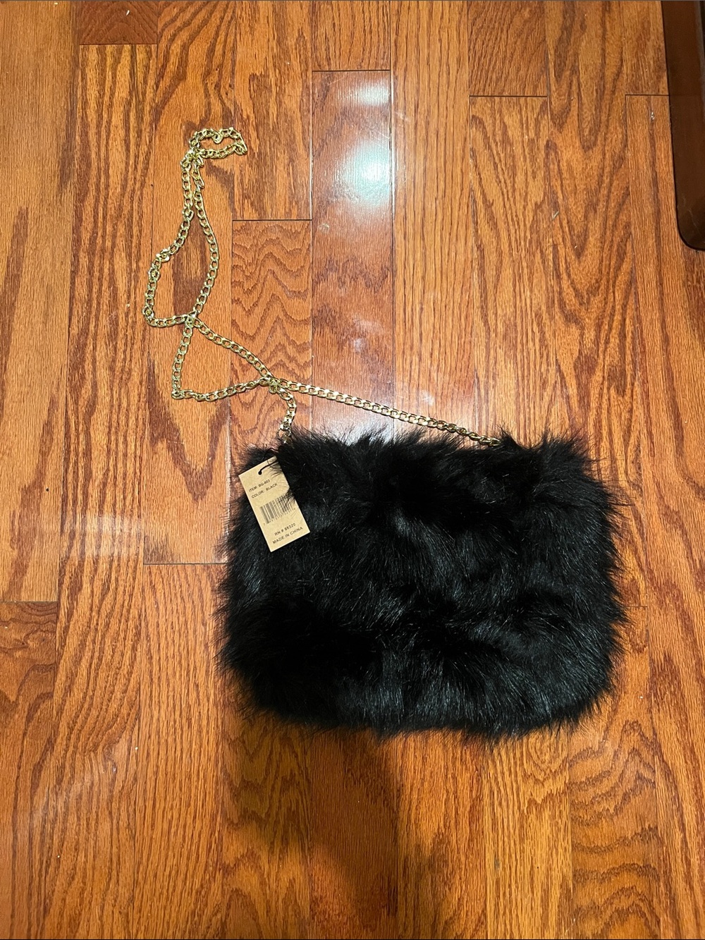 NWT C.C exclusives furry black  purse with gold chain.
